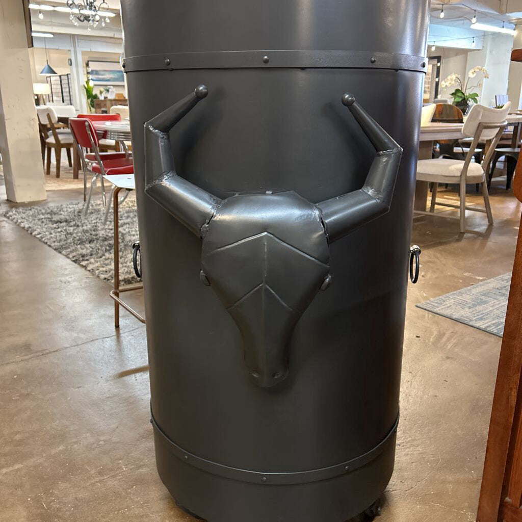 Dark gray armchair with unique design in a showroom setting