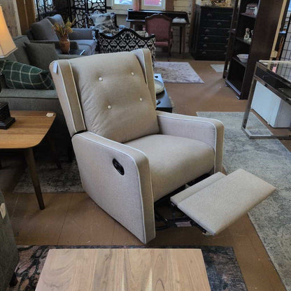 Beige recliner chair in a living room setting with furniture and decor.