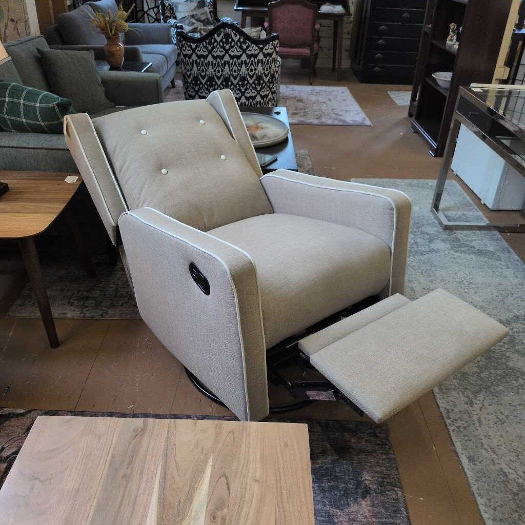 Beige recliner chair in a living room setting with furniture and decor.