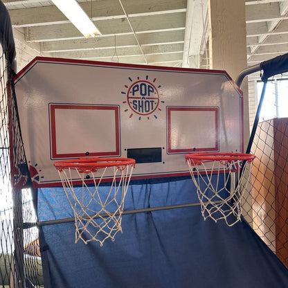 Basketball hoop with two backboards and Pop Shot logo on a blue background.