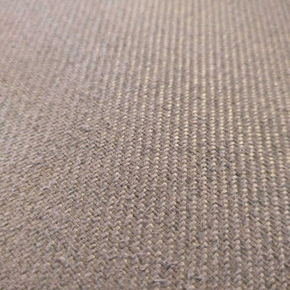 Close-up of a textured brown fabric surface
