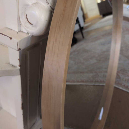 Close-up of a wooden chair leg with a blurred background