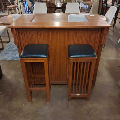 Wooden bar with two stools in a room setting