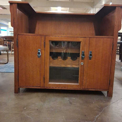 Wooden cabinet with glass door on a concrete floor