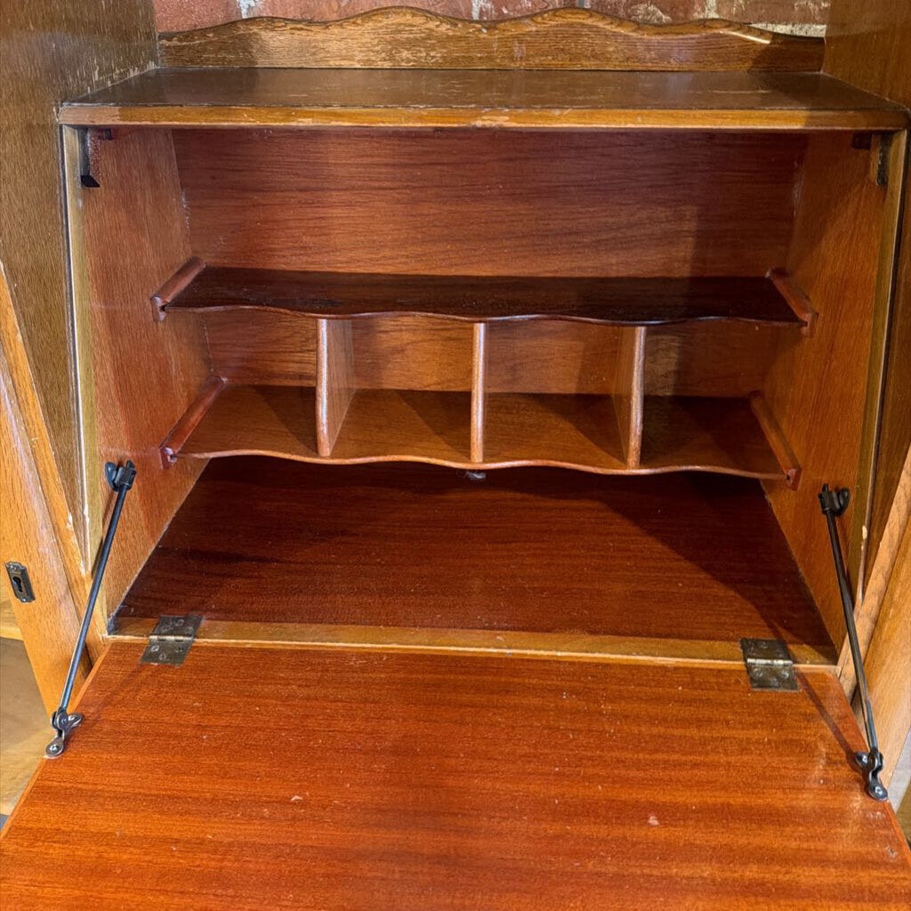 Wooden cabinet with shelves and metal brackets