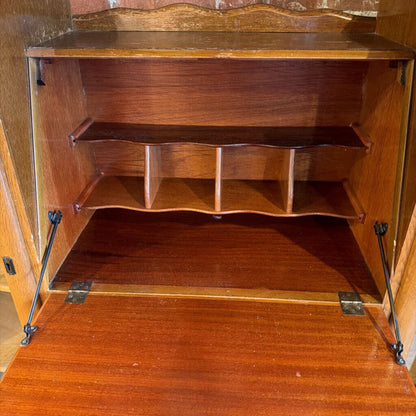 Wooden cabinet with shelves and metal brackets