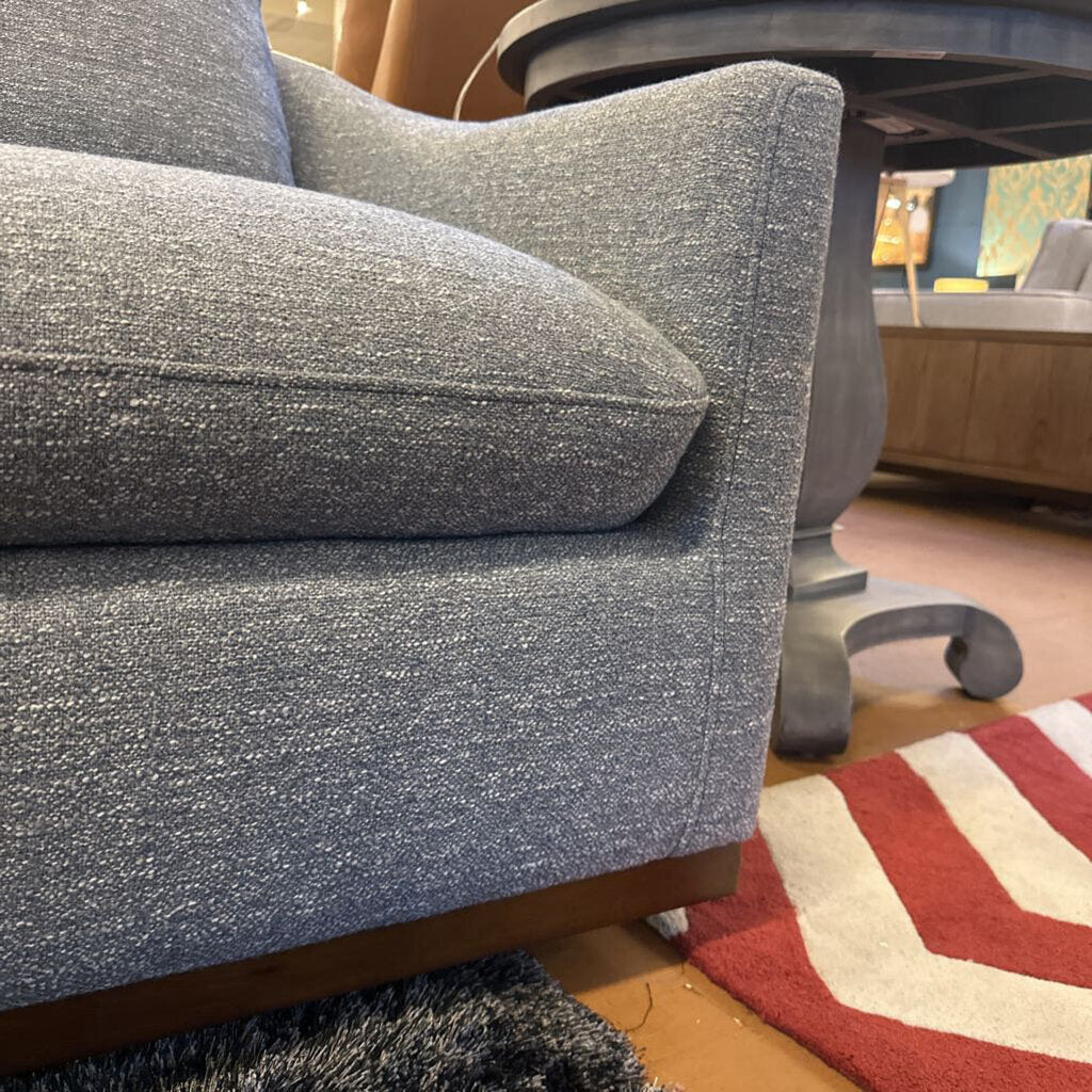 Gray textured sofa with a blurred background