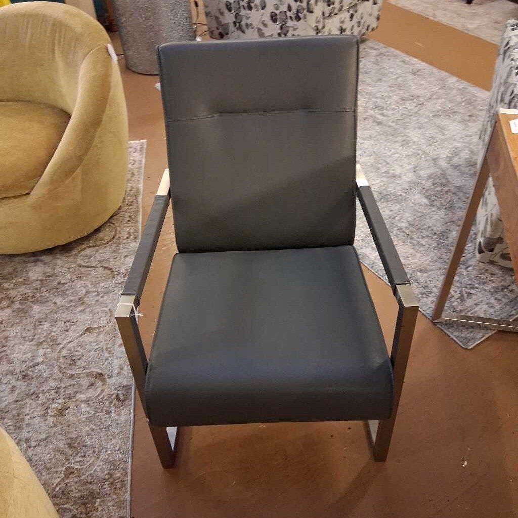 Gray chair with wooden frame in a room setting