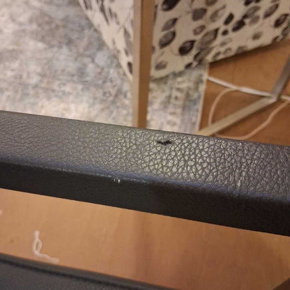 Close-up of a textured black object with a blurred background