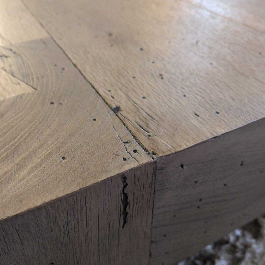 Close-up of a wooden surface with visible grain and texture