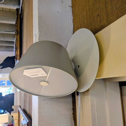 Gray wall-mounted lamp with a price tag attached, set against a neutral background.