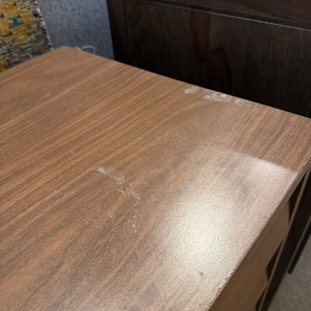 Wooden surface with visible scratches and marks