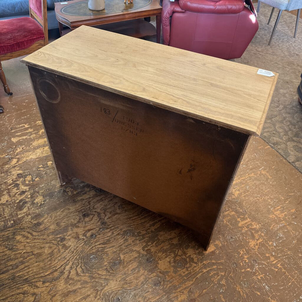 Wooden box with a label on a wooden floor