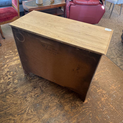 Wooden box with a label on a wooden floor