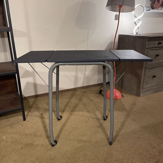 Foldable table with wheels in a room setting
