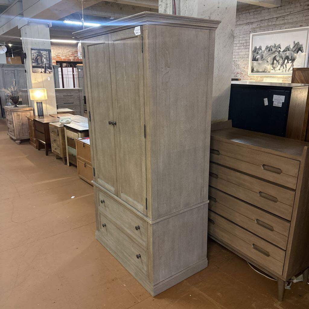 Wooden wardrobe in a furniture store with other items in the background