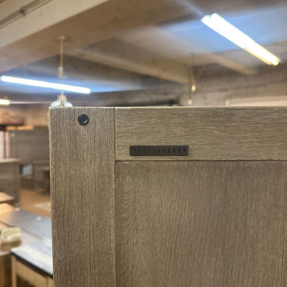 Wooden panel with a brand name label in an indoor setting