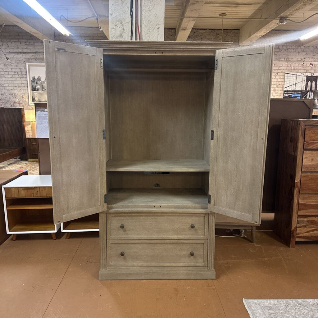 Wooden wardrobe with open doors in a furniture store setting