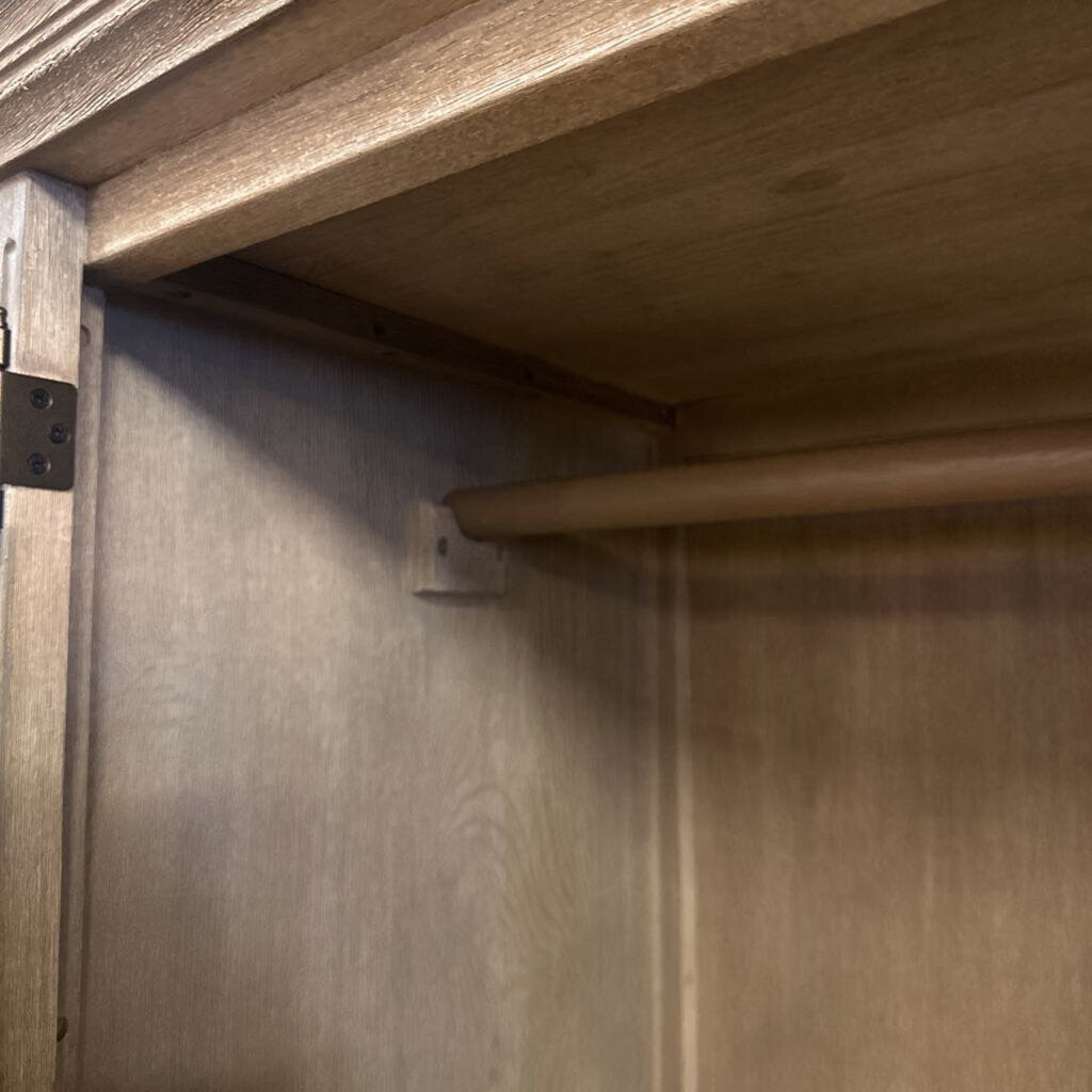 Close-up of wooden beams and metal brackets on a wooden structure.