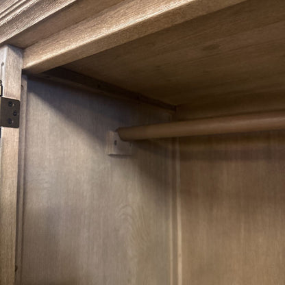 Close-up of wooden beams and metal brackets on a wooden structure.