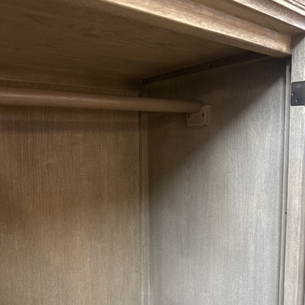 Close-up of a wooden shelf corner with a metal bracket.