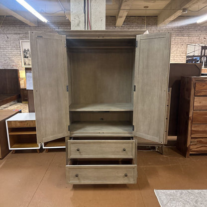 Wooden wardrobe with open doors in a showroom setting