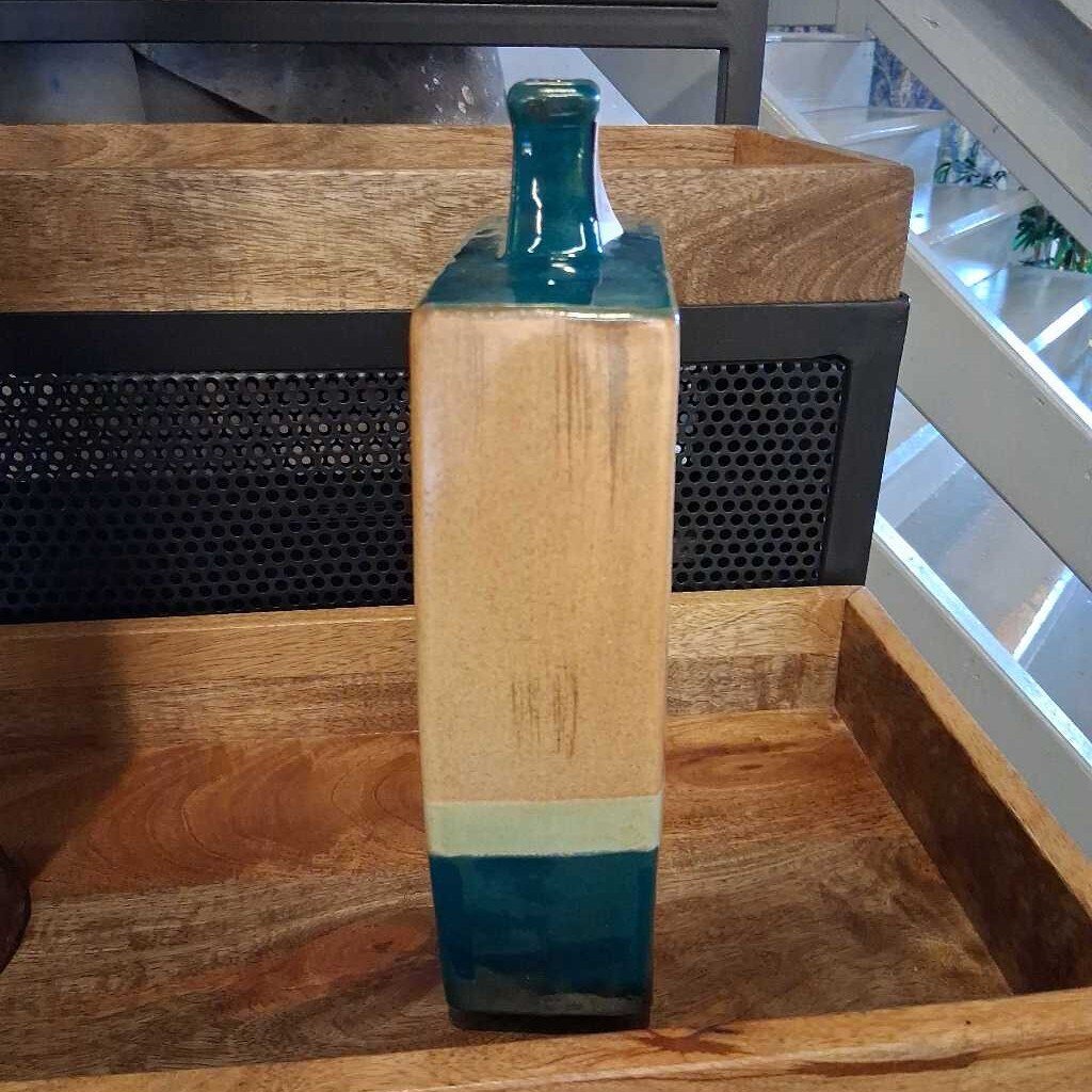 Wooden block with a blue glass top on a wooden surface