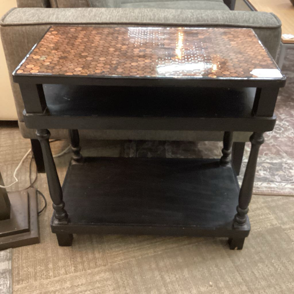 Small table with a decorative top in a room setting