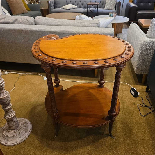 Wooden side table in a room with furniture
