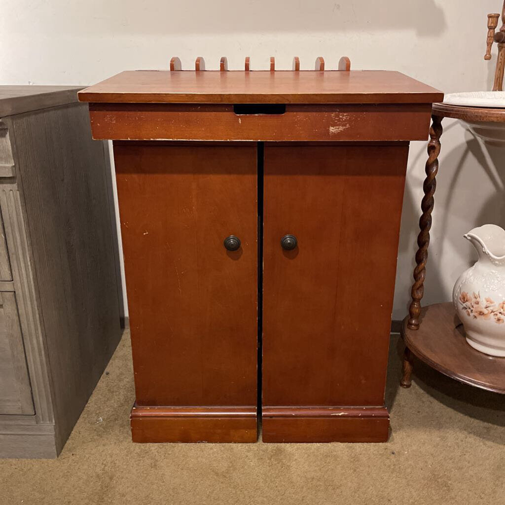 Wooden cabinet with two doors in a room setting