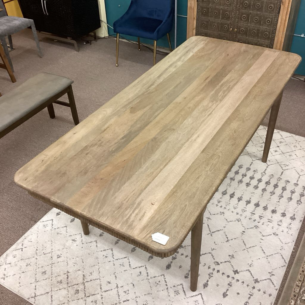Wooden table with a price tag in a store setting
