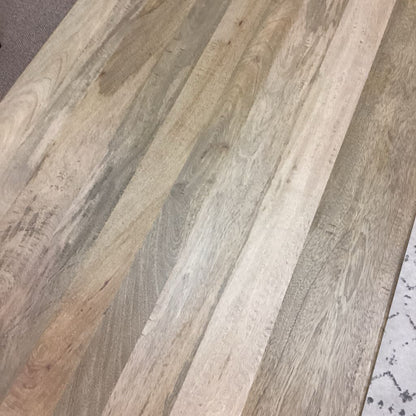 Close-up of wooden flooring with a natural wood grain pattern.