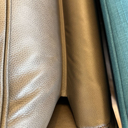 Close-up of leather textures in beige, brown, and teal.