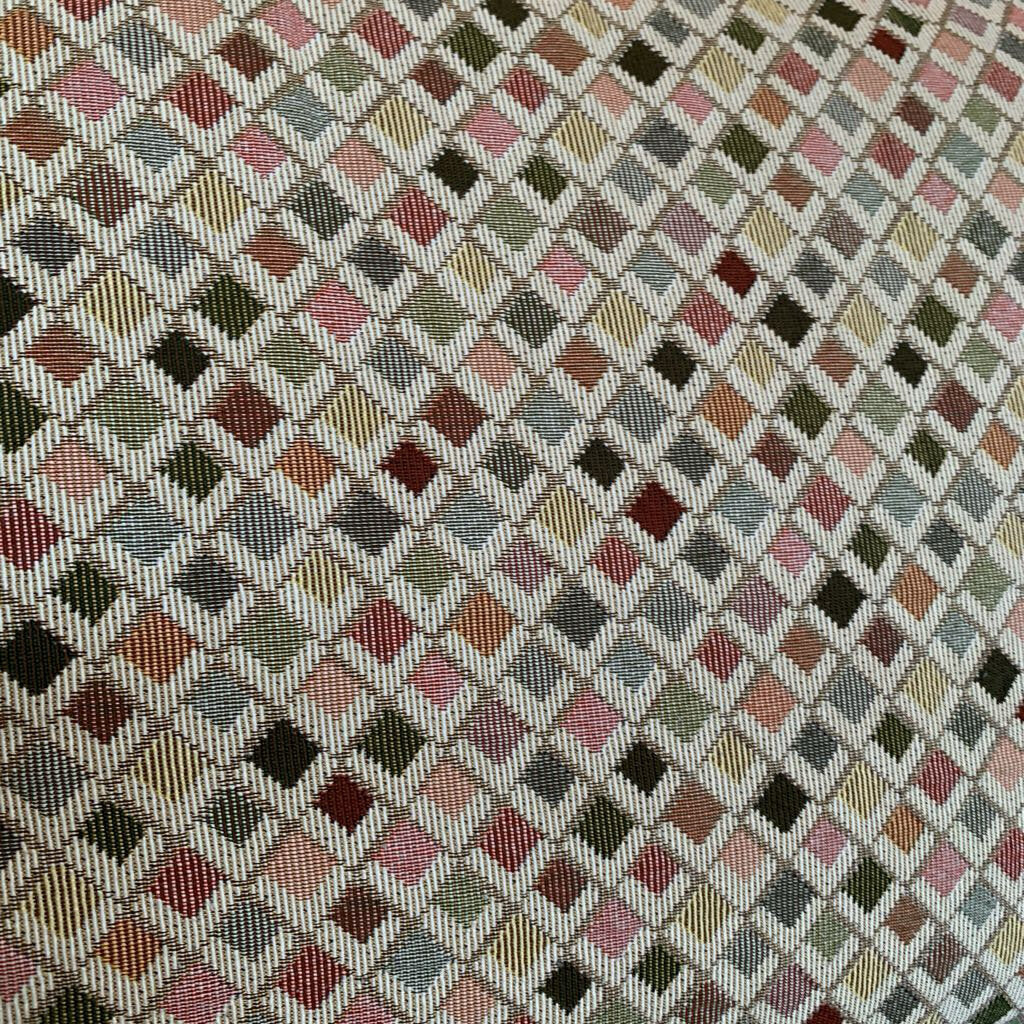 Patterned fabric with a diamond grid of multicolored squares