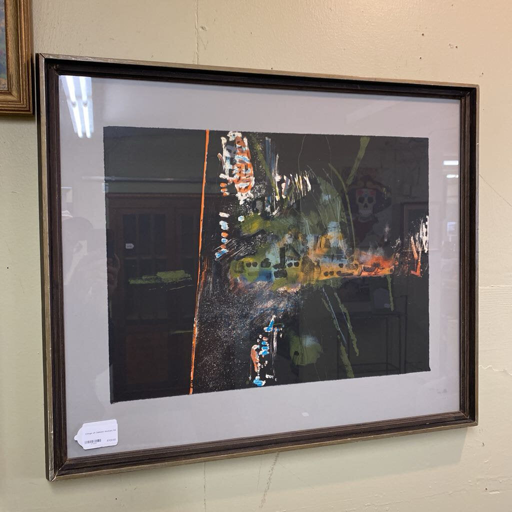 Framed abstract artwork on a wall