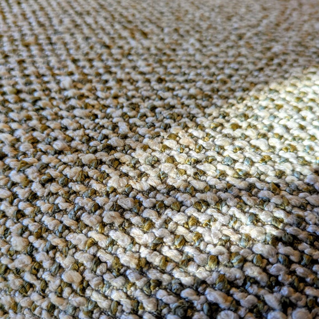 Close-up of textured beige and brown carpet