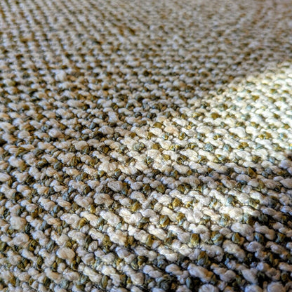 Close-up of textured beige and brown carpet
