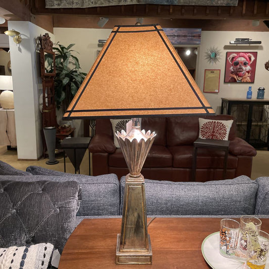 Decorative lamp on a table with a living room in the background