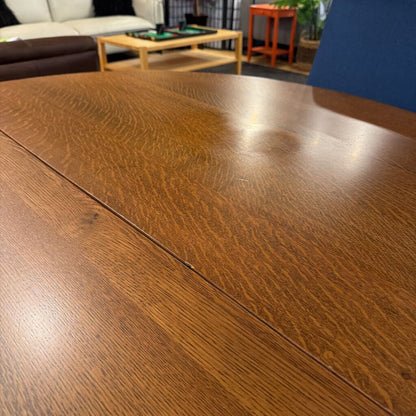 Close-up of a wooden surface with a blurred indoor setting