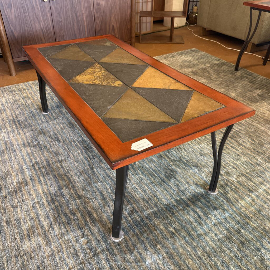 Coffee table with a geometric pattern on a carpeted floor