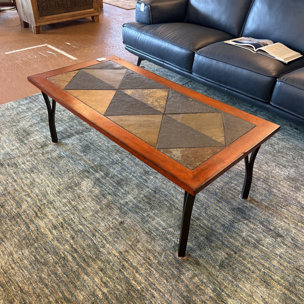 Wooden coffee table with geometric pattern in a living room setting