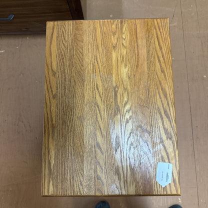 Wooden block with a visible brand label on a wooden floor