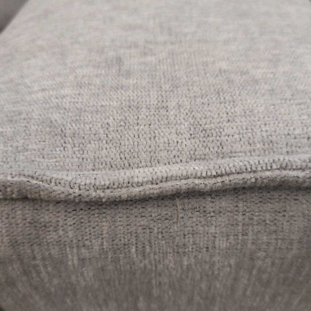 Close-up of a textured gray fabric surface