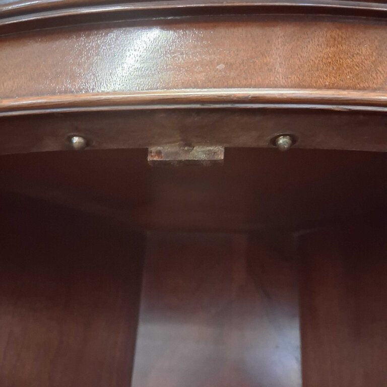 Close-up of a wooden surface with a metal bracket