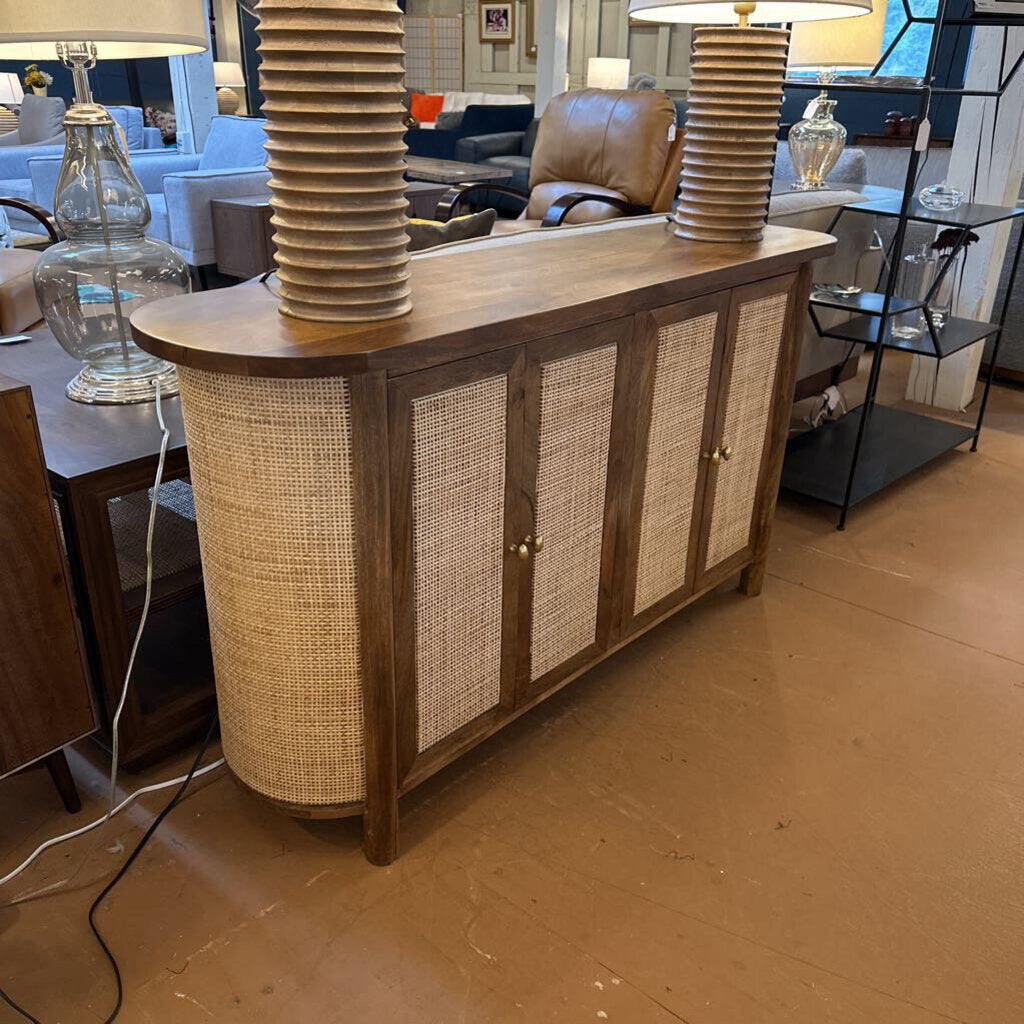 Wooden sideboard with woven design in a room setting