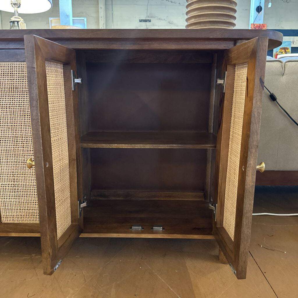 Wooden cabinet with open doors on a wooden floor
