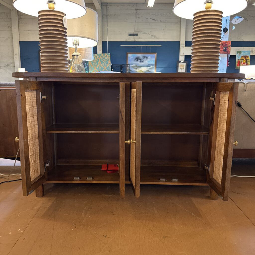 Wooden cabinet with open doors in a store setting