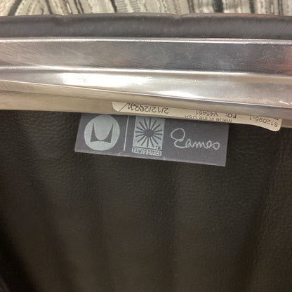 Close-up of a metal product with visible branding on a textured background