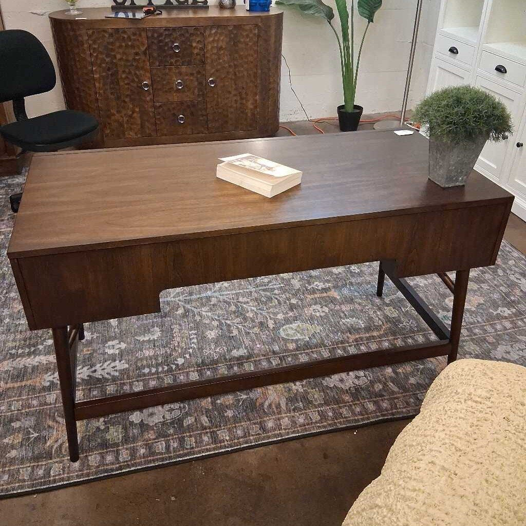 Brown wood writing desk with drawers