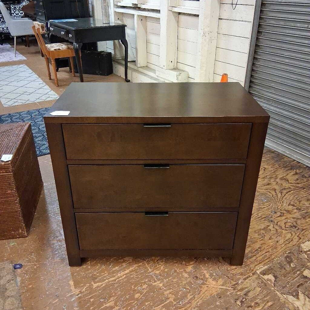 Wooden dresser with two drawers in a room setting